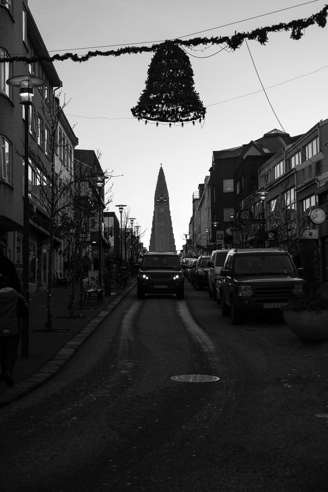 The large Lutheran church, Hallgrímskirkja, in Reykjavik, Iceland from the bottom of the main shopping road during Christmas time. Photo by Mike Higdon